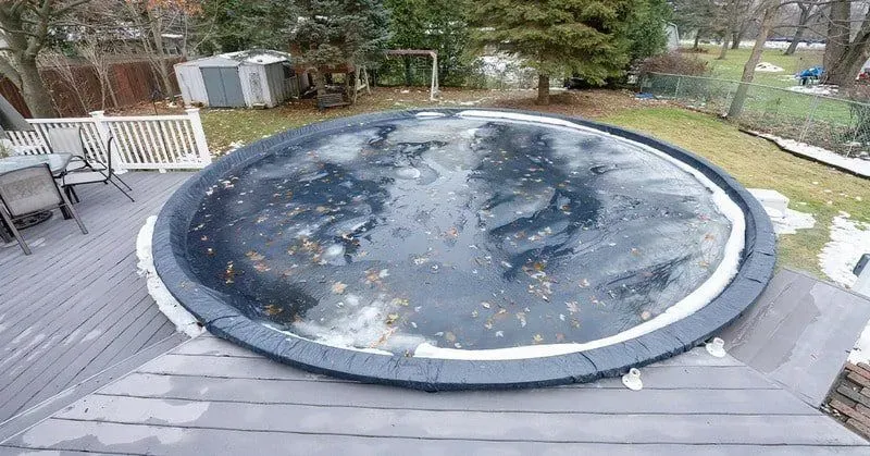 a frozen pool in the wintertime