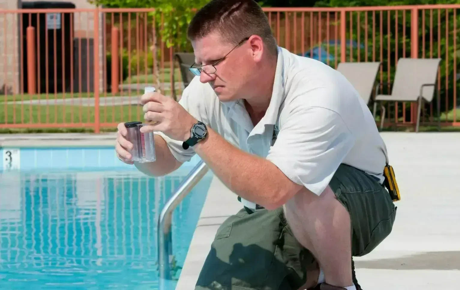 person working and pool water testing