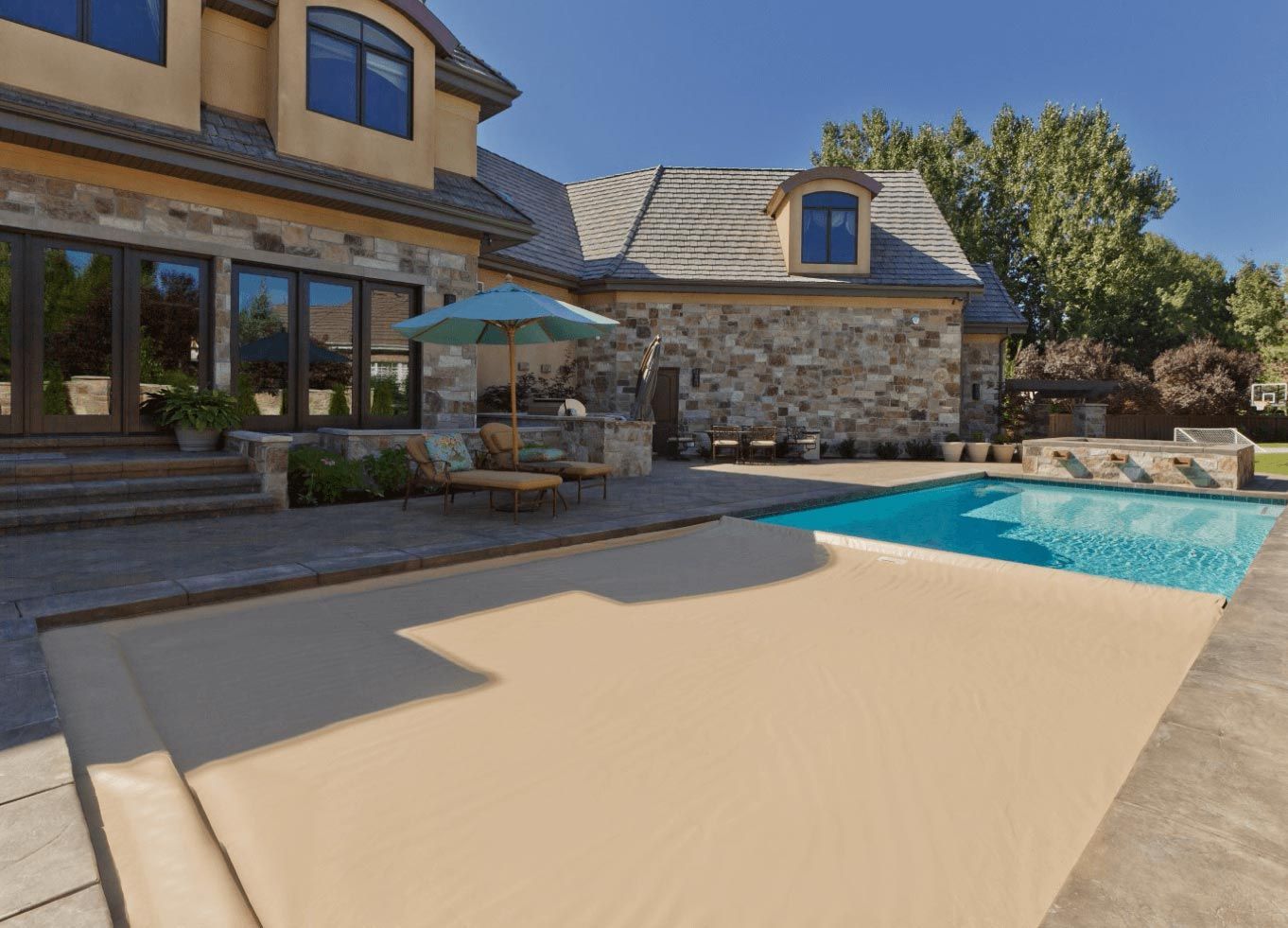 a tan pool cover that automatically  deploys
