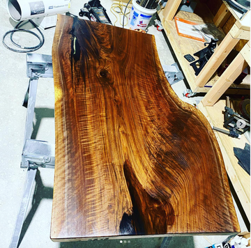 a large piece of wood is sitting on a table