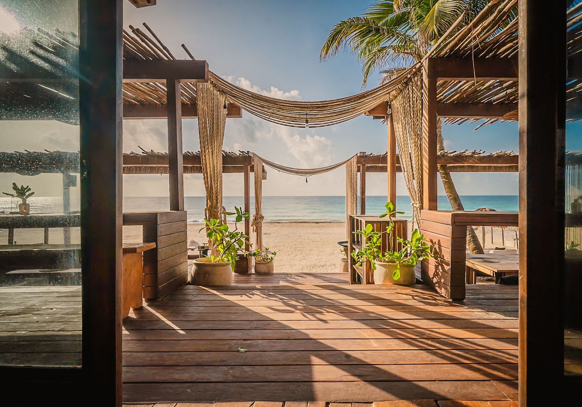 A wooden deck with a view of the ocean.