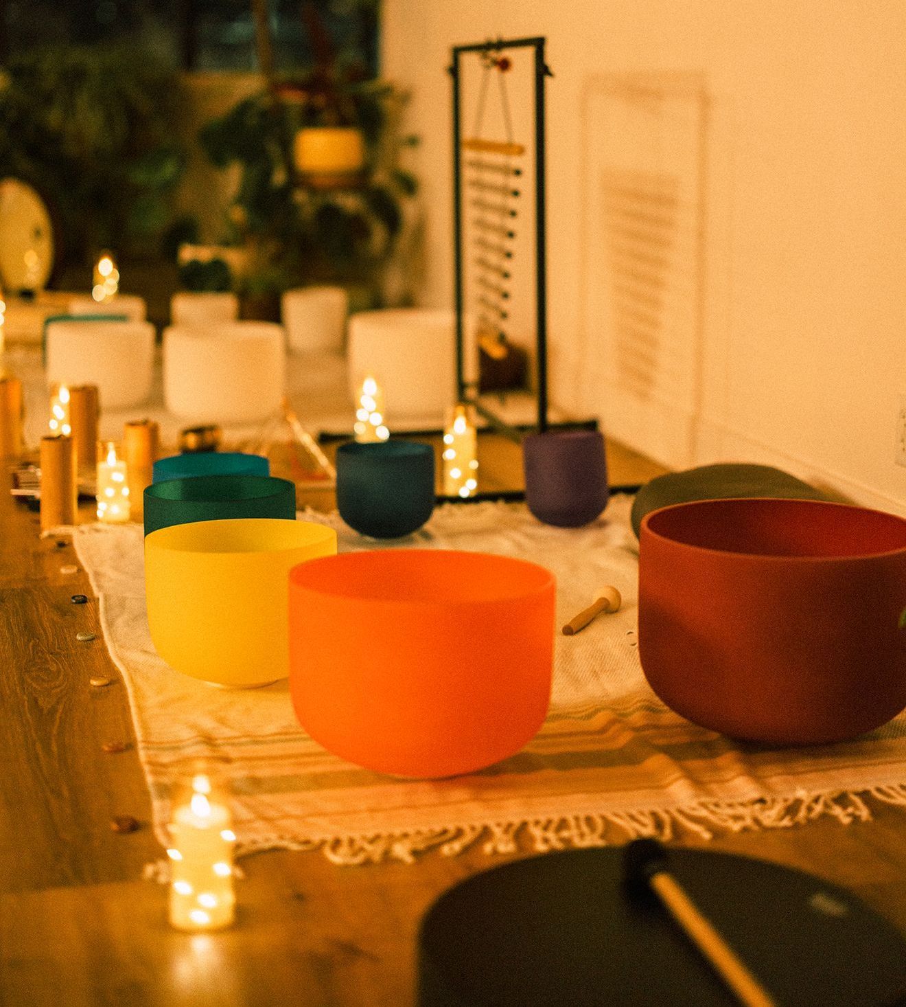 A table with bowls and candles on it