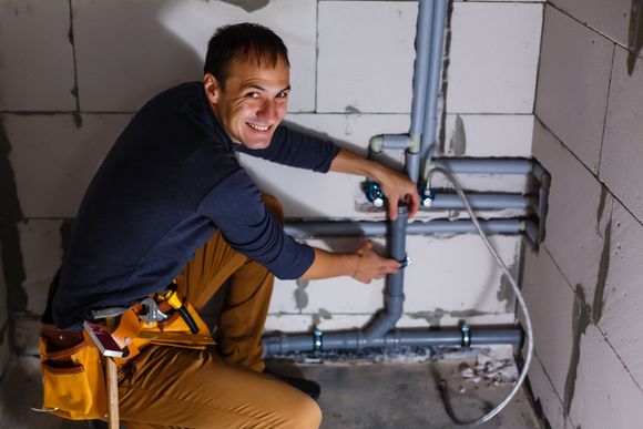 Plumber makes wiring of sewer pipes