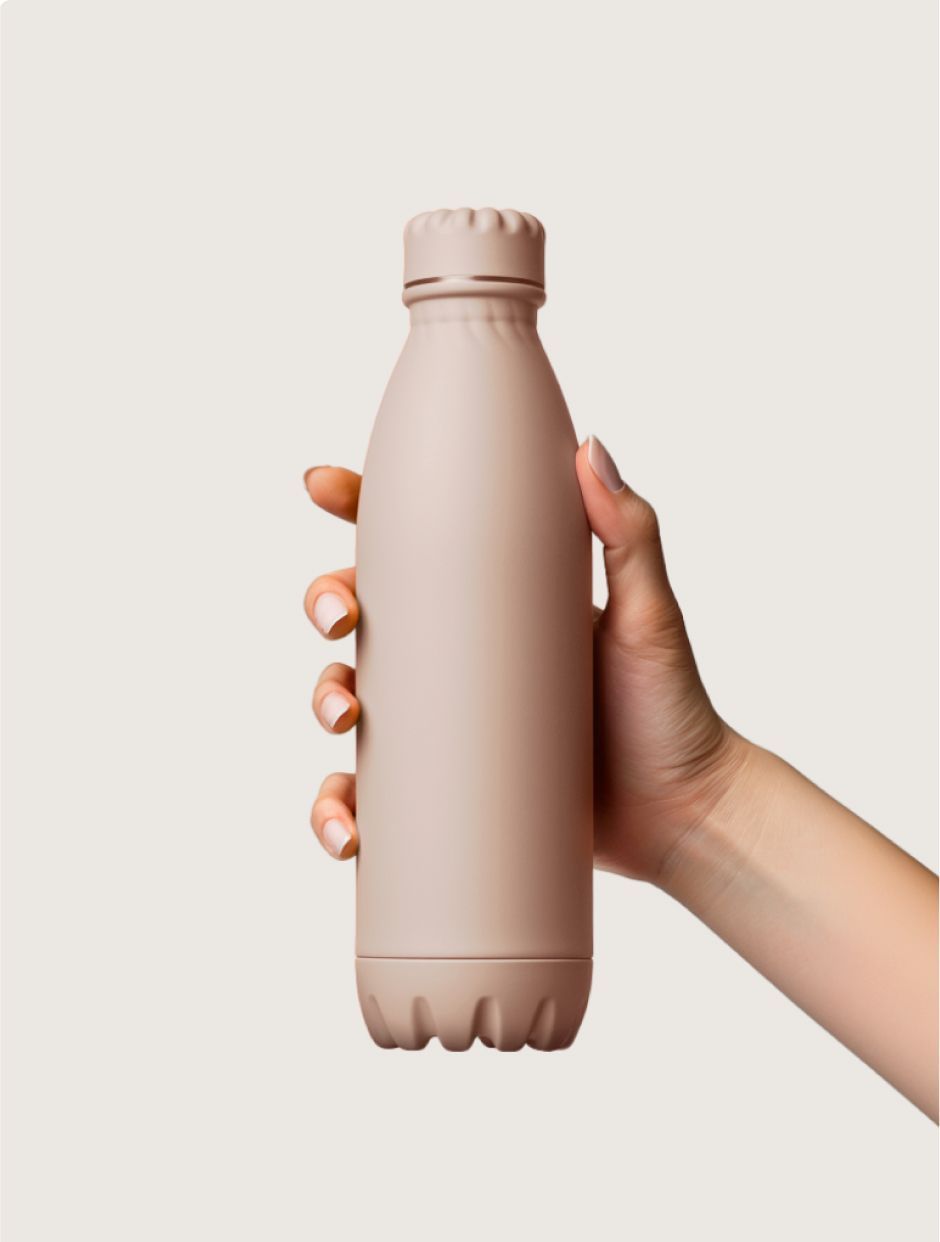 Person holding a beige insulated water bottle.