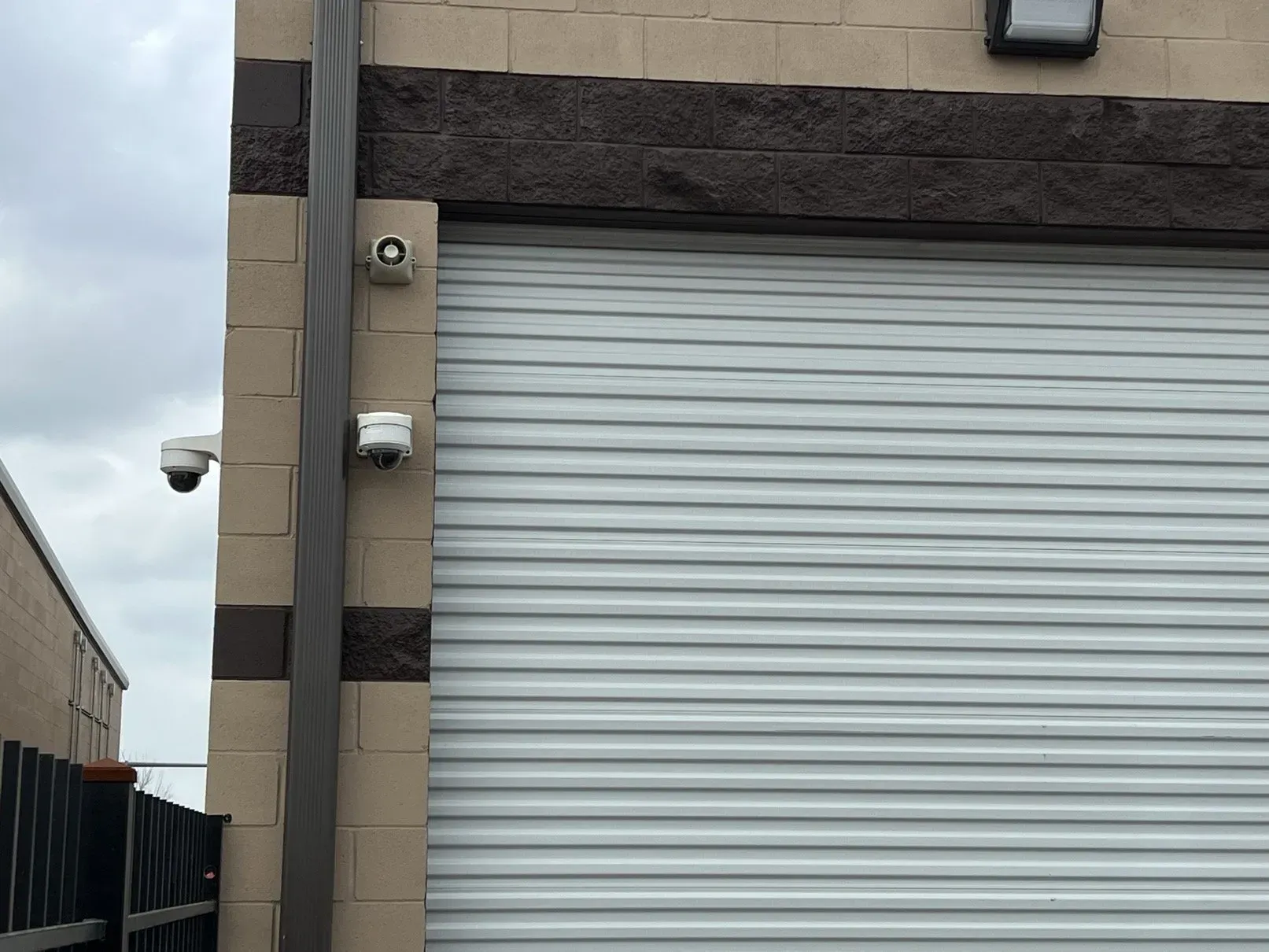 Two security cameras on a building 
