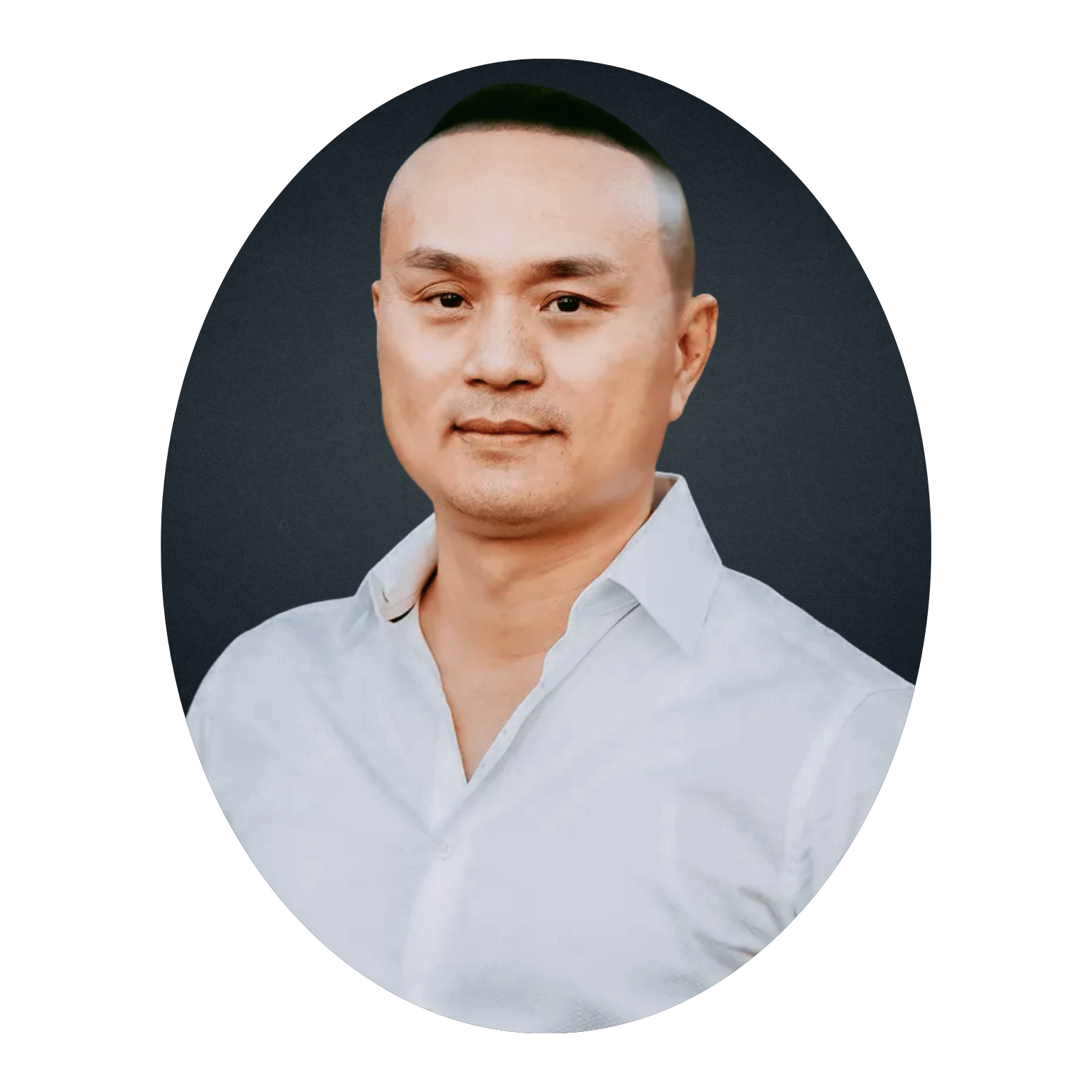 Asian man in a white shirt looking at the camera, set against a dark background.