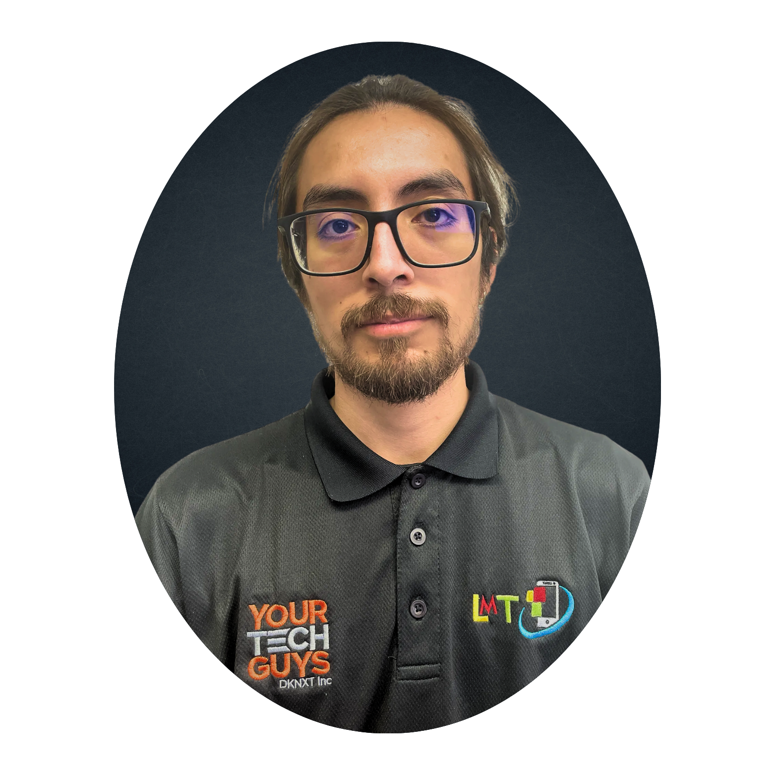 Man with glasses and a beard, wearing a black polo shirt with the