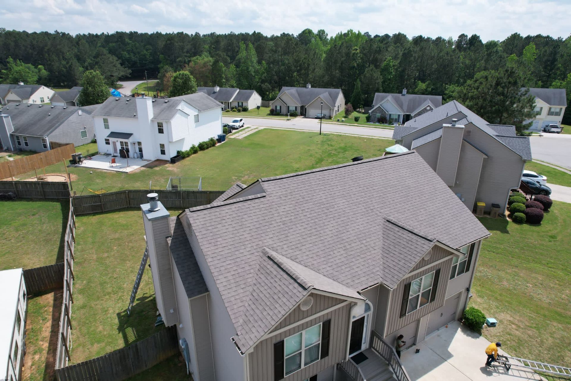 An aerial view of a house in a residential area