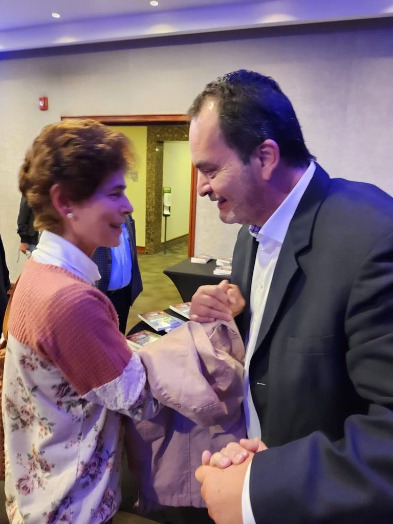 A man and a woman are holding hands in a room