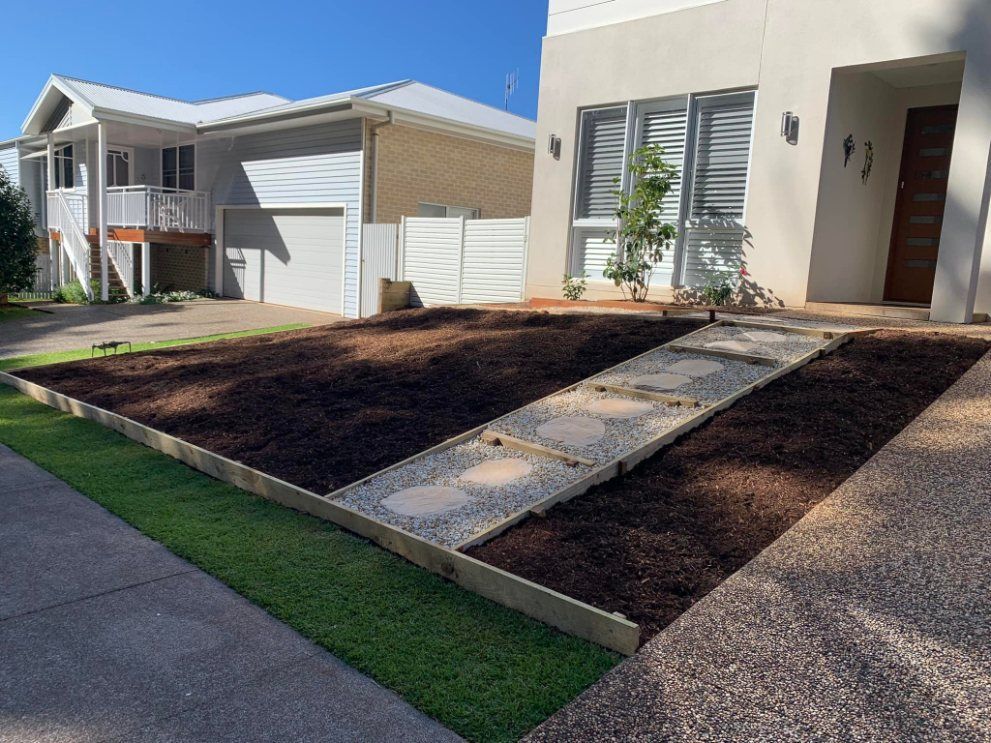 A House With a Driveway and a Lawn in Front of It — Greener Gardens Gardening Service In Wauchope, NSW