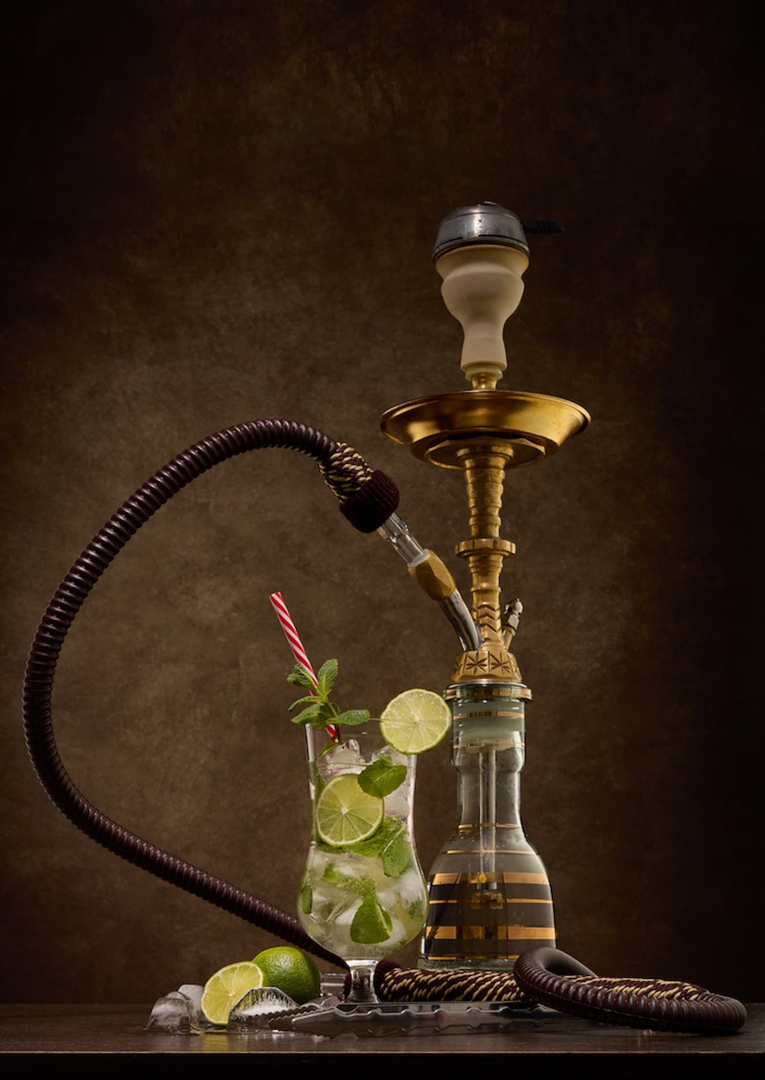 A Hookah Is Sitting Next to A Glass of Mojito — Mini Market Townsville Smoke Shop in Townsville City, QLD