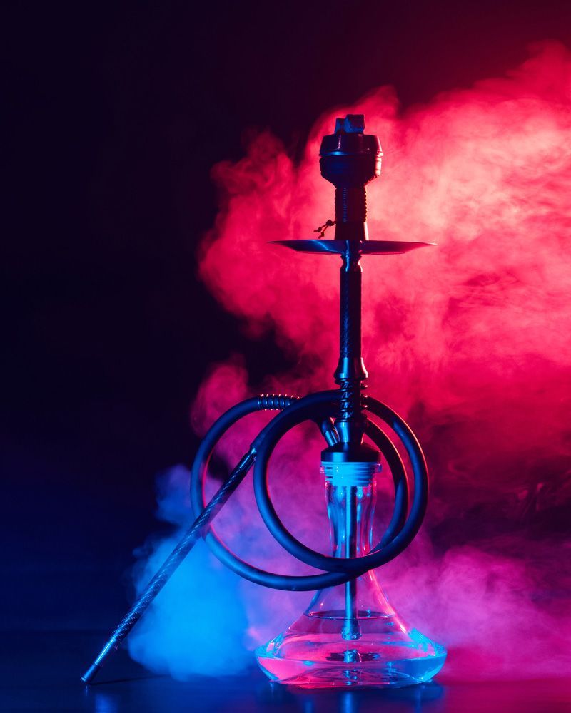 A Hookah with Smoke Coming out Of It Is Sitting on A Table — Mini Market Townsville Smoke Shop in Townsville City, QLD