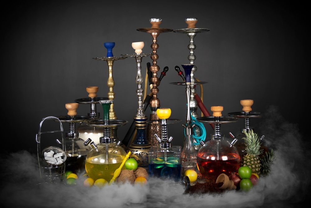 A Group of Hookahs Sitting Next to Each Other on A Table — Mini Market Townsville Smoke Shop in Townsville City, QLD