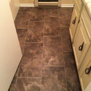 Hard Flooring Below White Cabinet — Peru, IN — Peru Vacuum, Carpet & Flooring