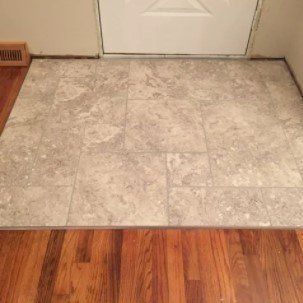 White Hard Flooring in Front of Door — Peru, IN — Peru Vacuum, Carpet & Flooring