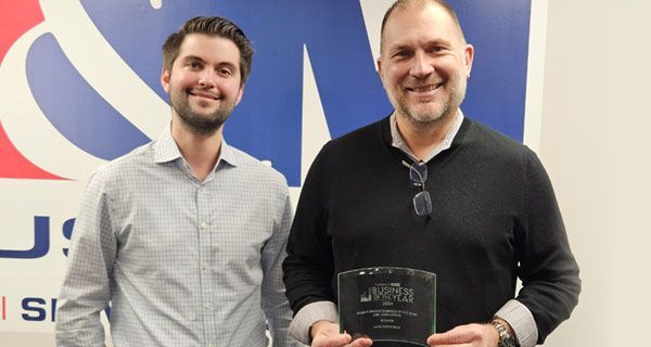 Josh Young and Rob Zatorsky pose with the NJBIZ Business of the year award