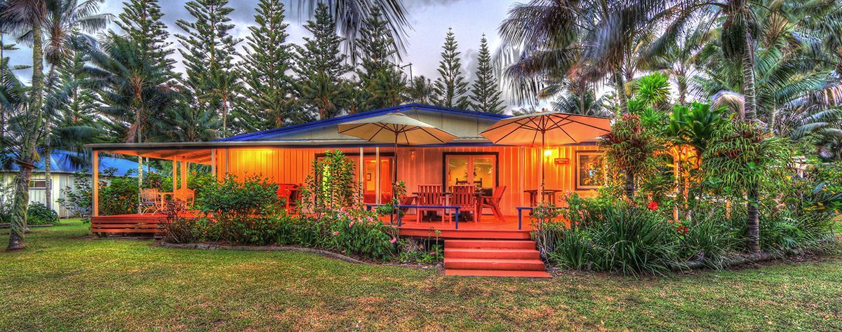 A cozy wood cabin with orange lights. Norfolk Island Trade Winds Seniors Sanctuary