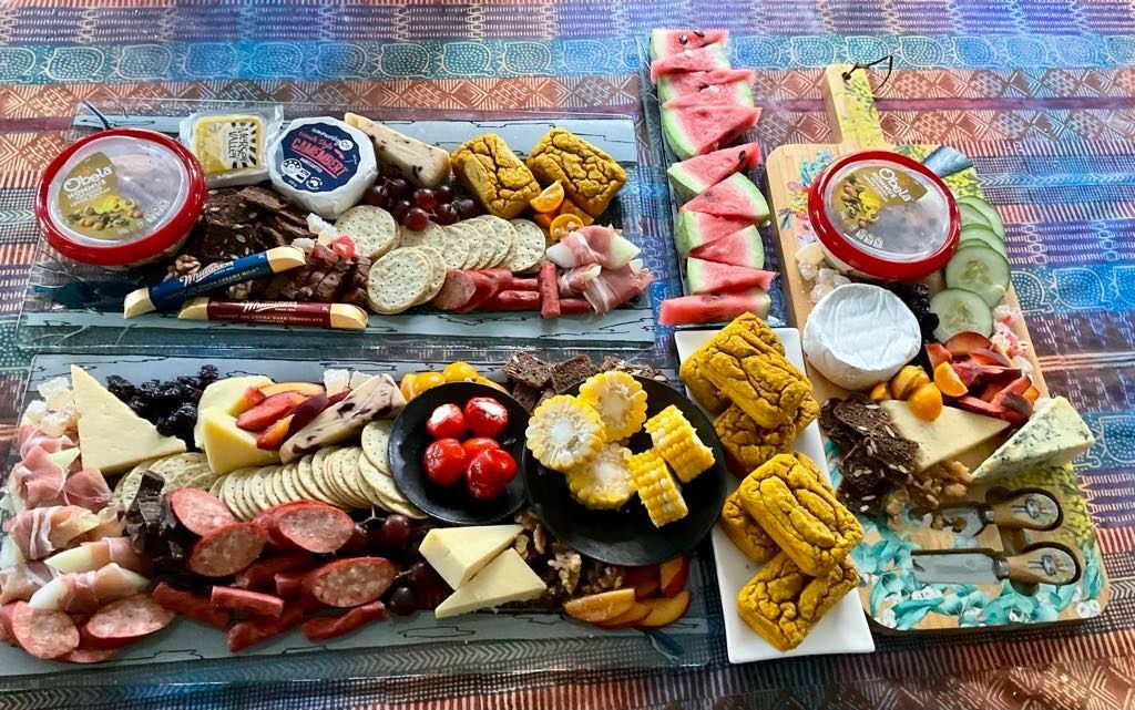 Charcuterie boards with cheeses, meats, fruit, corn, and table. Norfolk Island Trade Winds Seniors Sanctuary