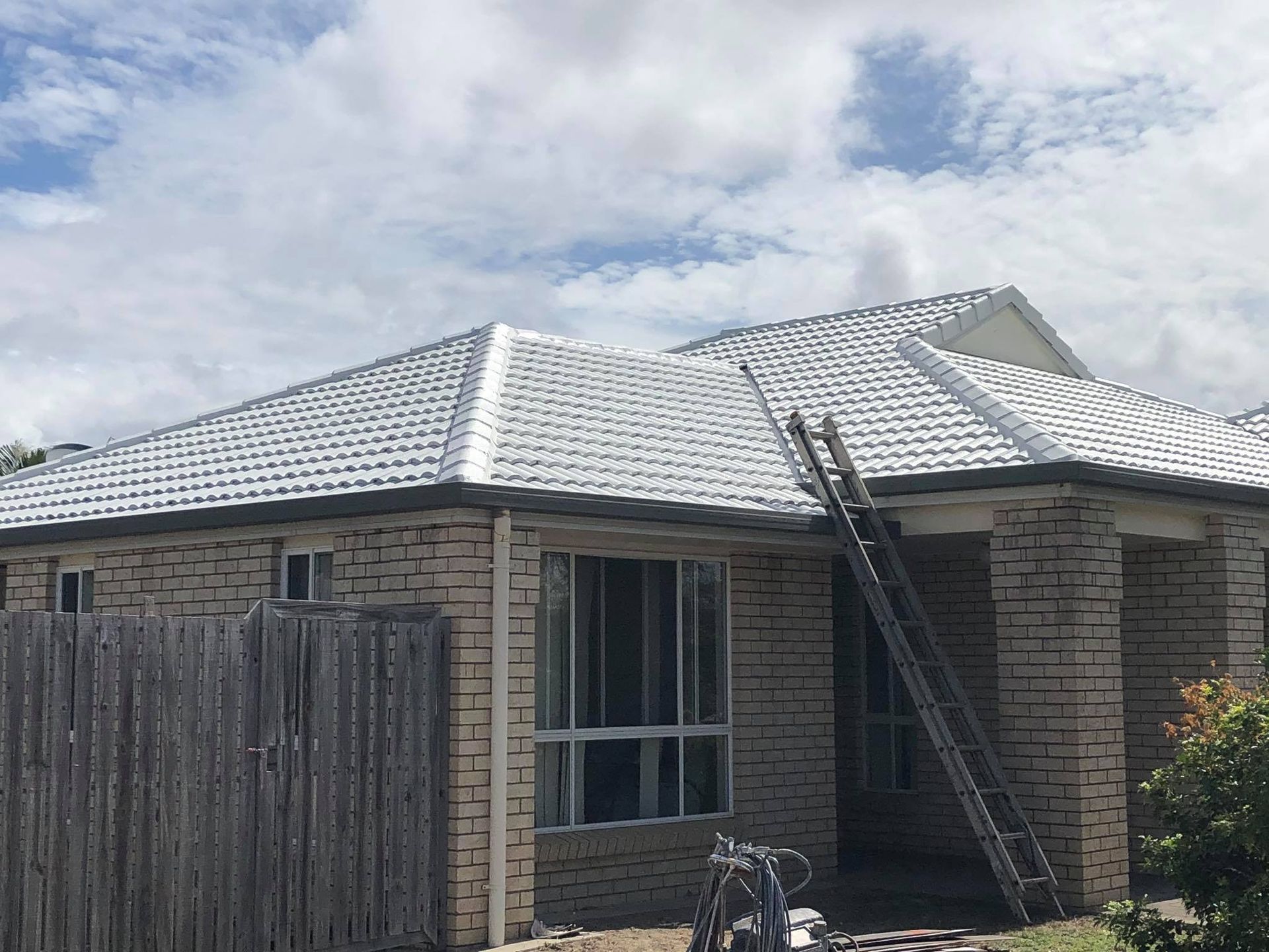 House With a White-painted Tile Roof and a Ladder — Roof Tek CQ in Rockhampton, QLD