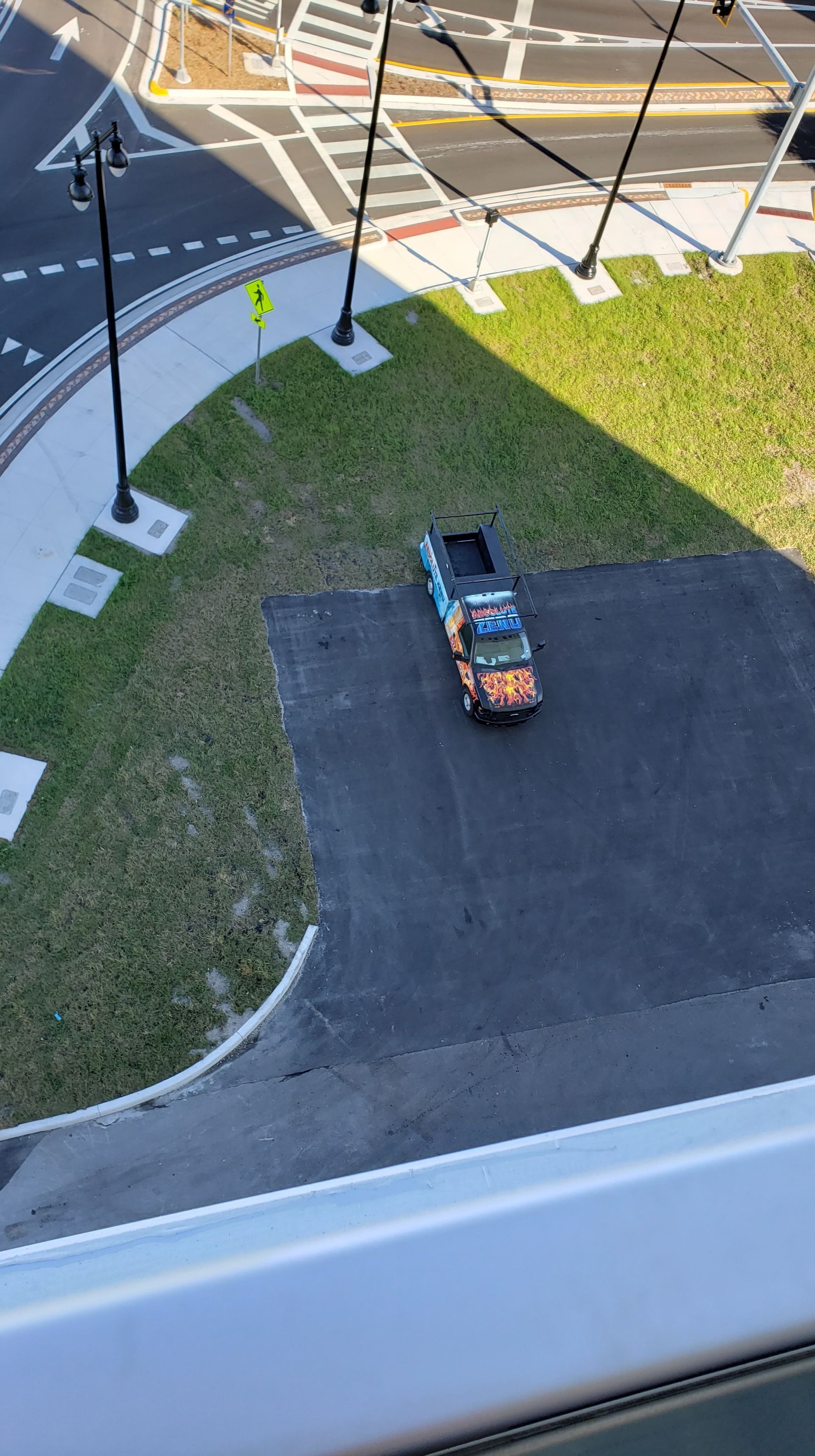 An aerial view of a truck parked in a parking lot.