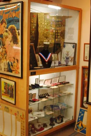 A display case of a large number of scouting medals