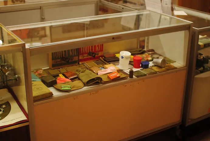 A display case of scout hats and accessories