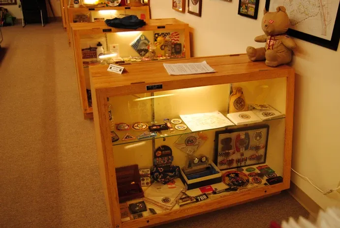 Rows of display cases of scouting memorabilia