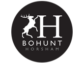 A black and white logo for bohunt horsham with a deer in a circle.