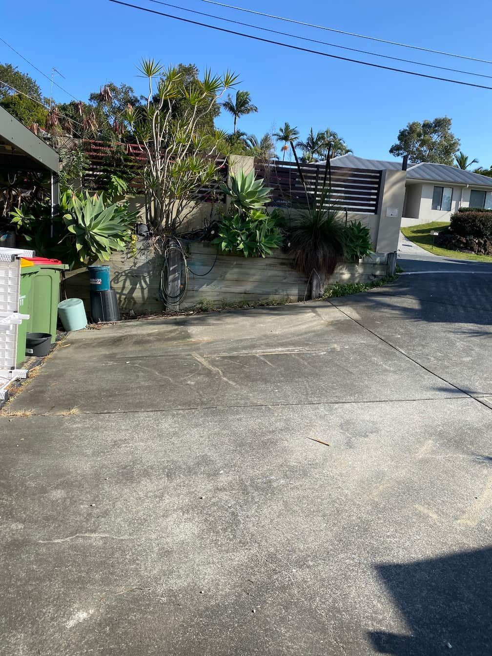 A dirty concrete driveway.