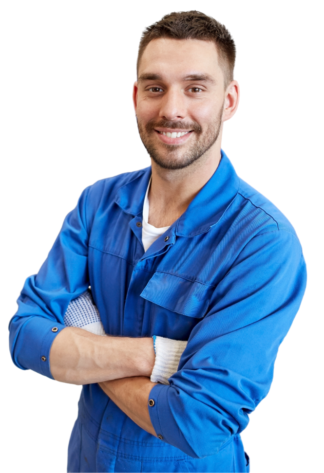 Mechanic in blue jumpsuit, arms crossed, smiling.