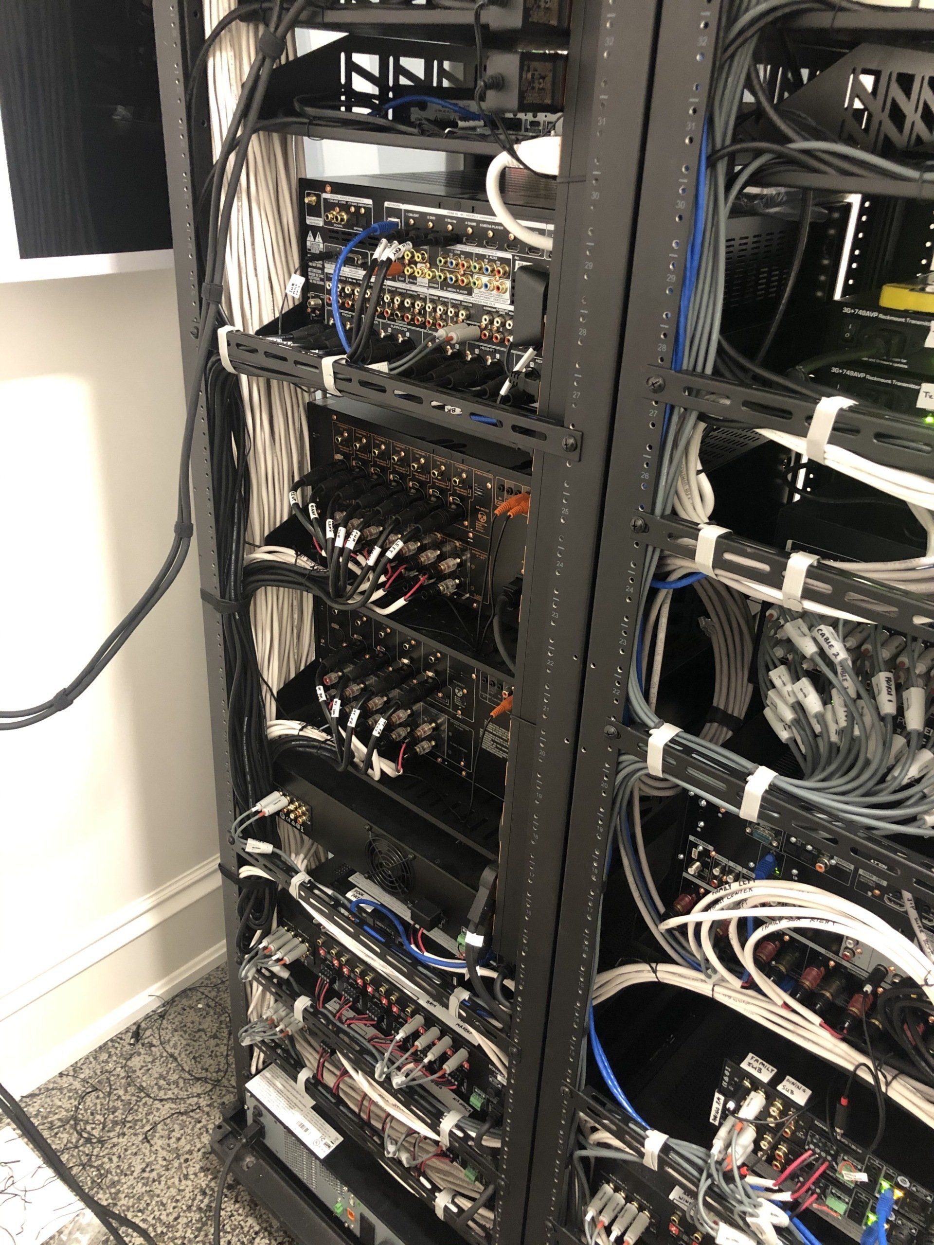 A server rack filled with lots of wires and cables.