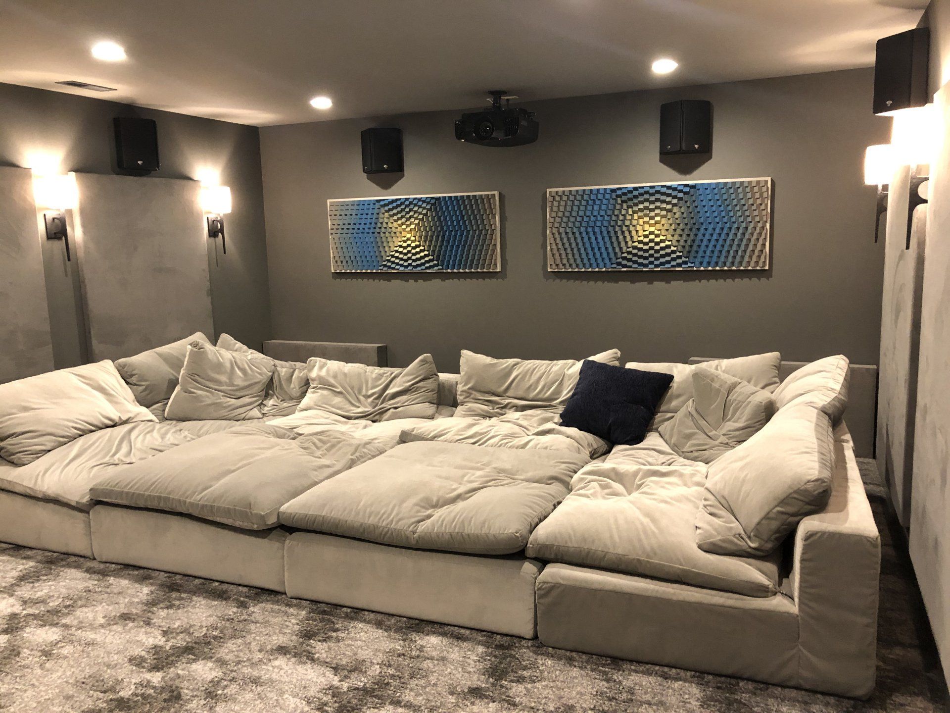 There is a large couch in the middle of the room.