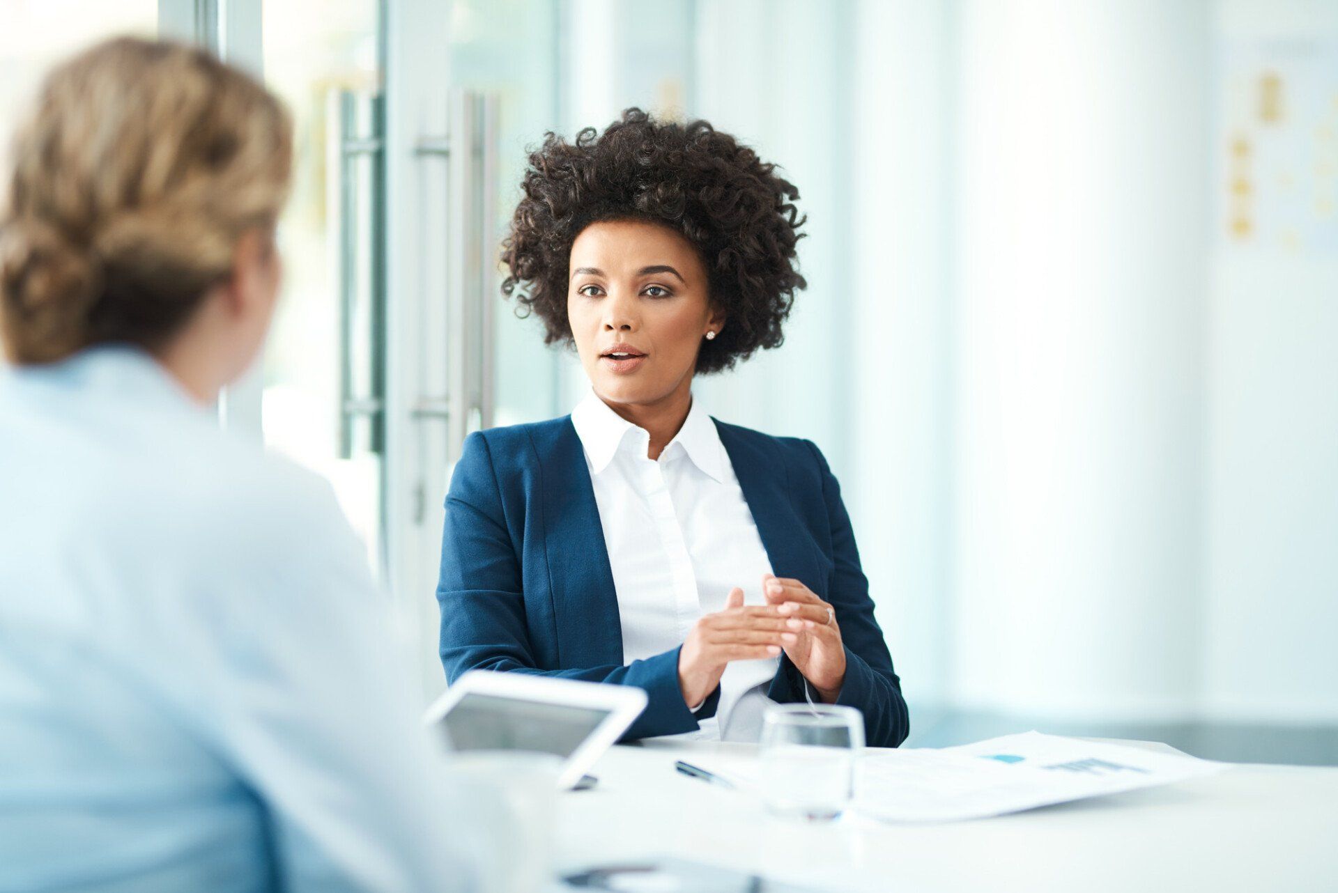 Shot of two businesspeople having a discussion in a modern office