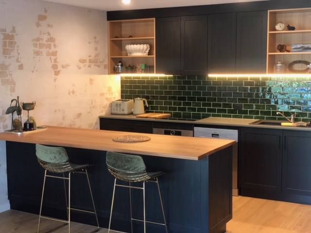 A Kitchen With Black Cabinets And A Wooden Counter Top — Alstonville Kitchens In Alstonville, NSW