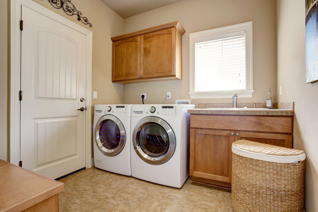 A Laundry Room With A Washer And Dryer And A Sink — Alstonville Kitchens In Alstonville, NSW
