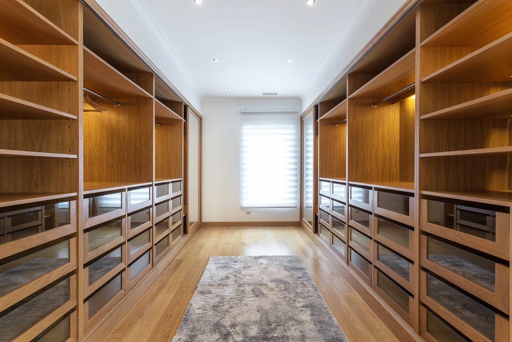 A Walk In Closet With Lots Of Shelves And Drawers — Alstonville Kitchens In Alstonville, NSW