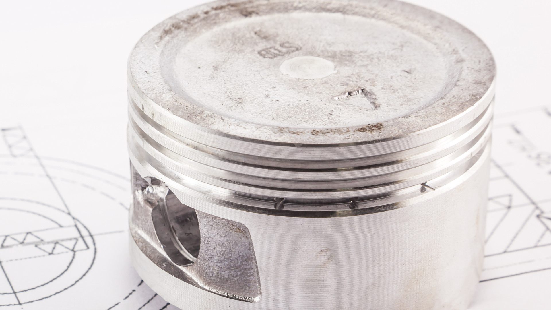 A close up of a piston on top of a drawing