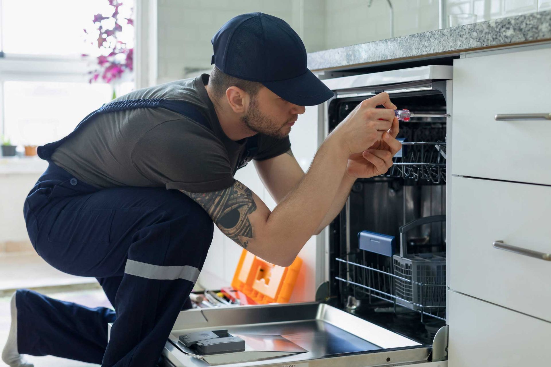 Man Repairing Dishwasher — High Point, NC — Appliance & Repair