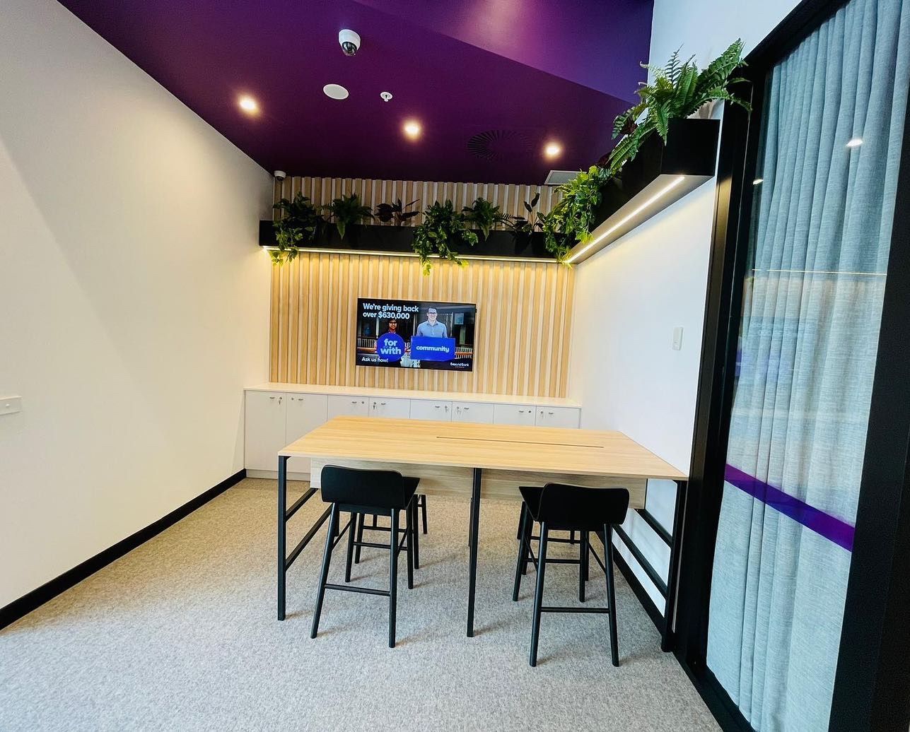 A Room With a Table, Chairs and a Television On The Wall — Nyon Shopfitters in Morisset, NSW