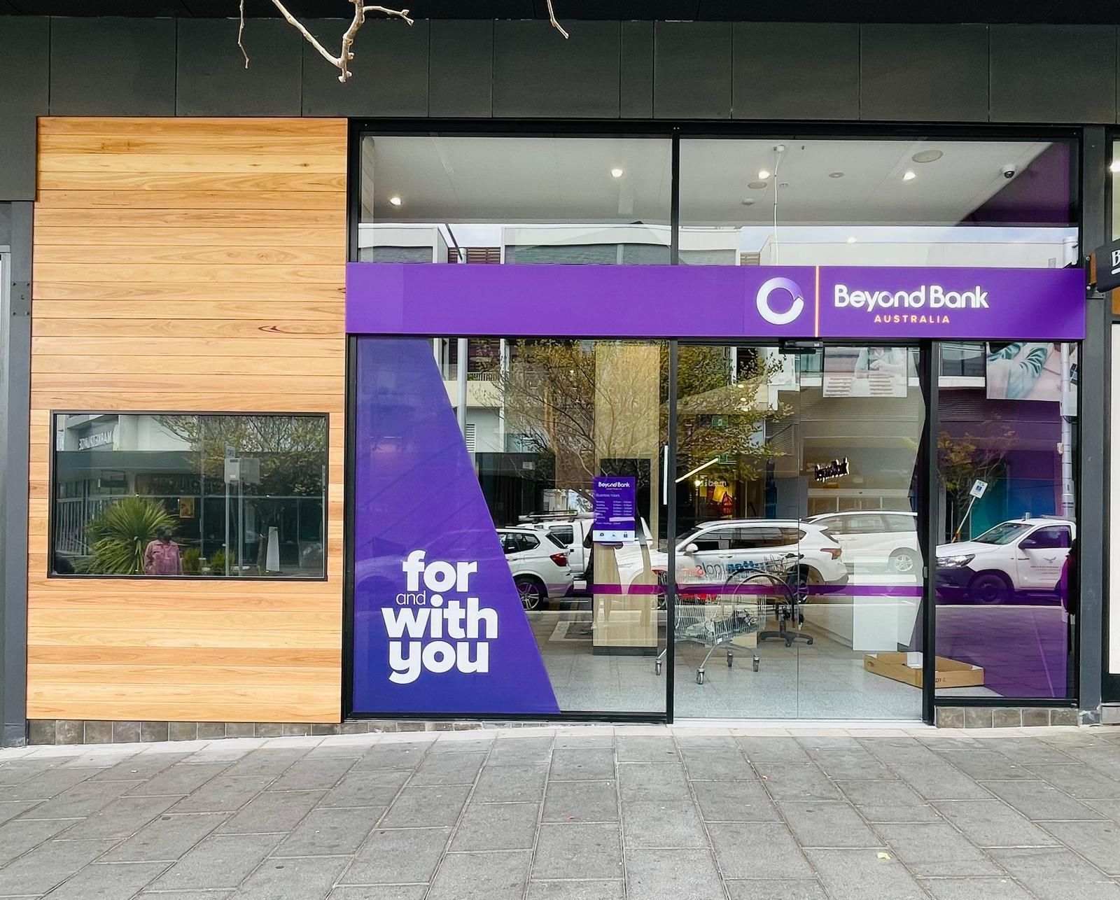 The Front of a Bank With a Purple Sign — Nyon Shopfitters in Morisset, NSW
