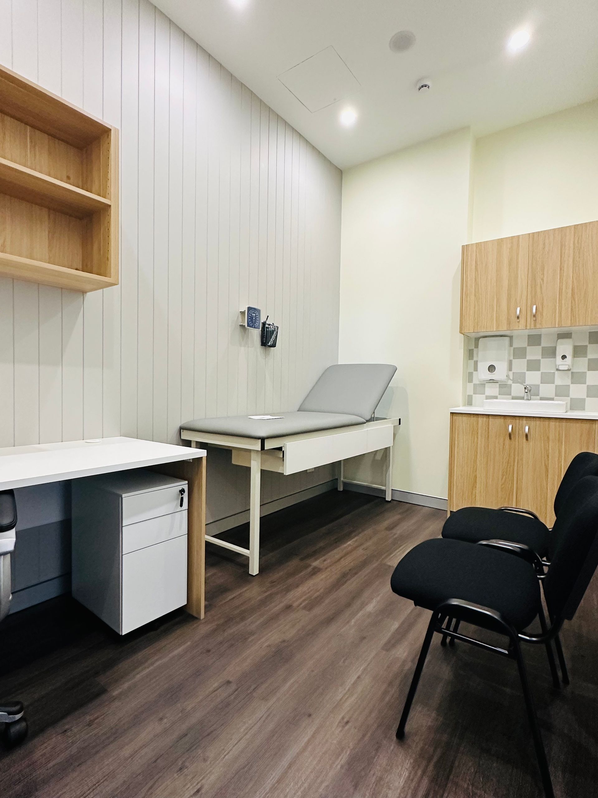 A Doctor's Office With a Bed, Chairs, and a Desk — Nyon Shopfitters in Morisset, NSW