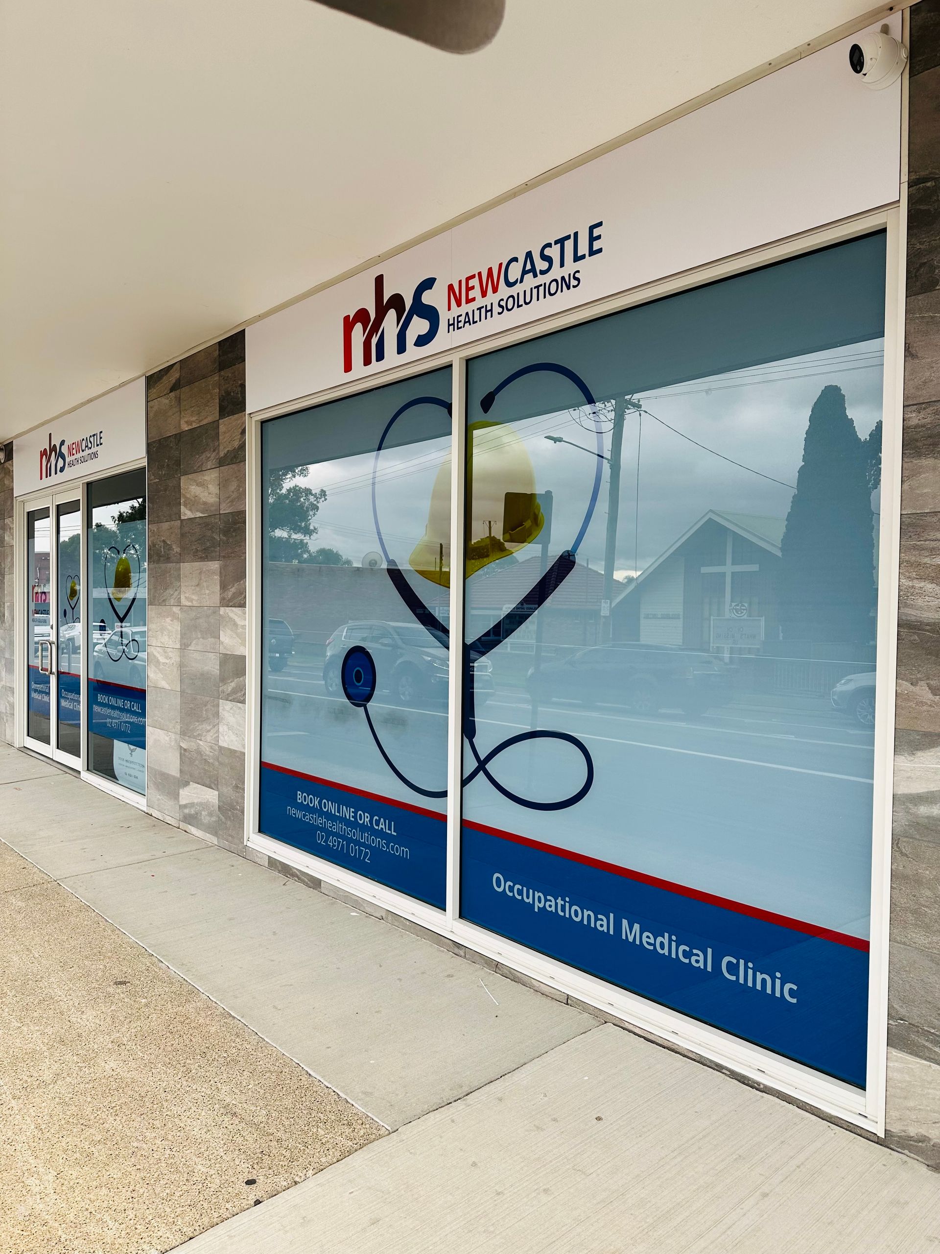 The Outside Of A Building With A Stethoscope On The Window — Nyon Shopfitters in Morisset, NSW