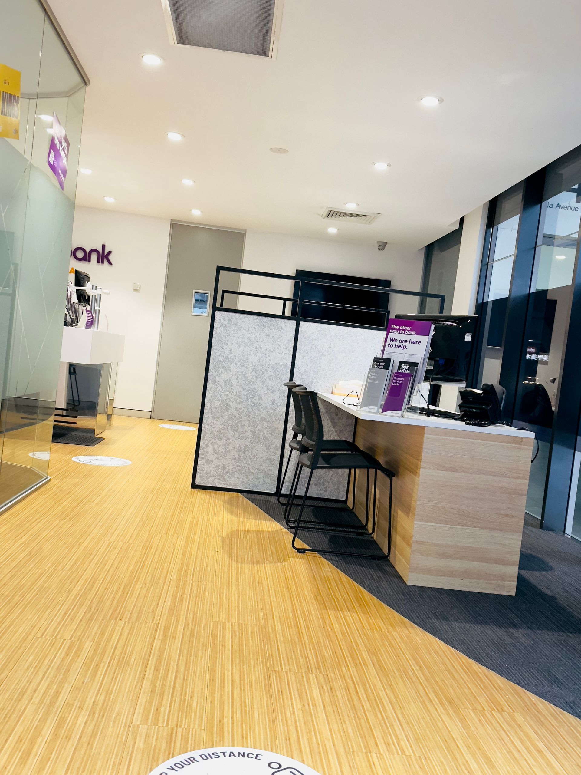 A Room With a Wooden Floor and a Desk in the Middle of it — Nyon Shopfitters in Morisset, NSW