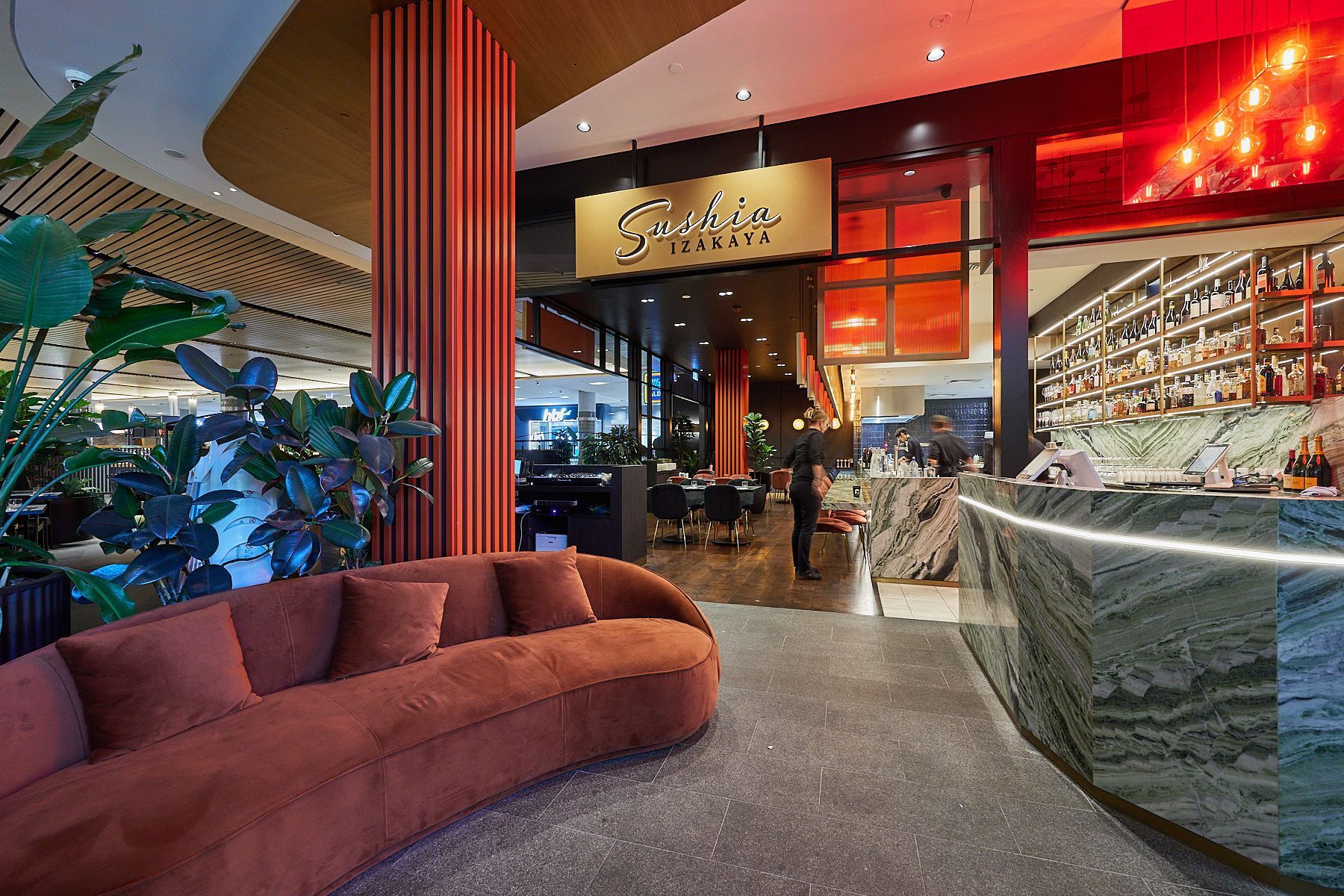 There Is A Couch In The Middle Of The Room In Front Of A Restaurant — Nyon Shopfitters In Morisset, NSW
