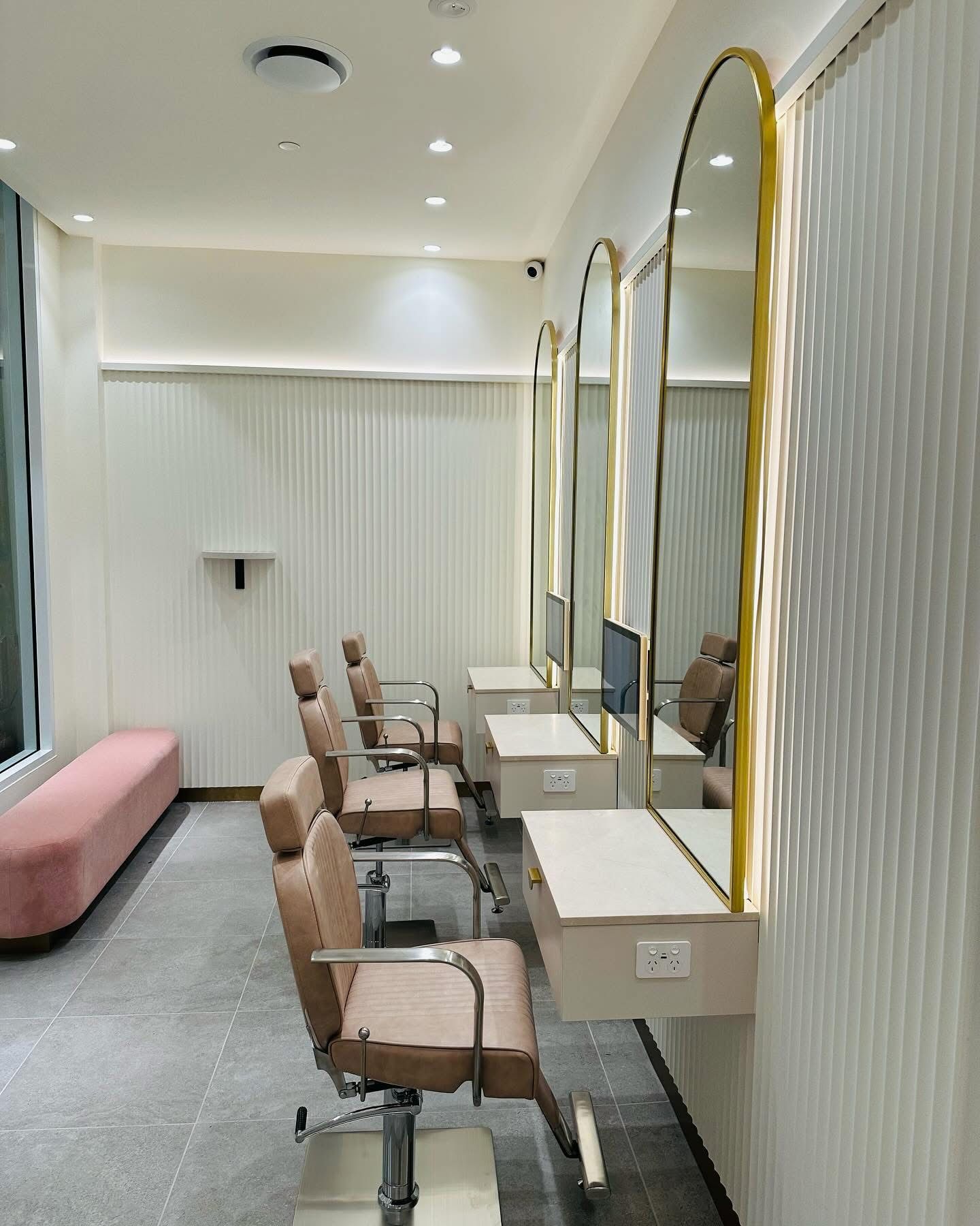 A Row of Chairs And Tables In a Room With Mirrors — Nyon Shopfitters in Morisset, NSW
