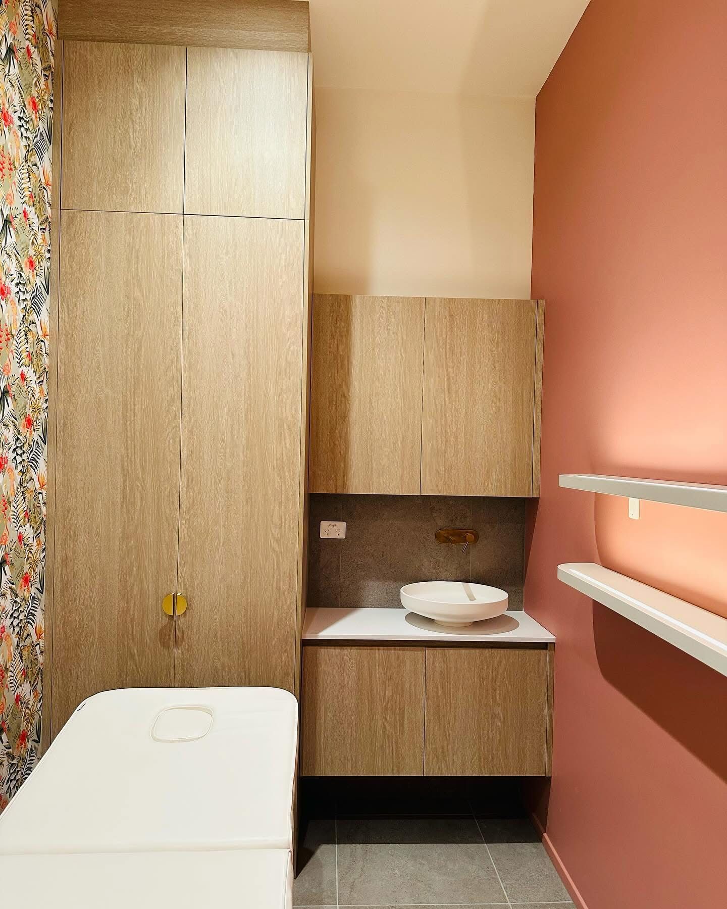 A Bathroom With a Sink, Cabinets, Shelves and a Bed — Nyon Shopfitters in Morisset, NSW