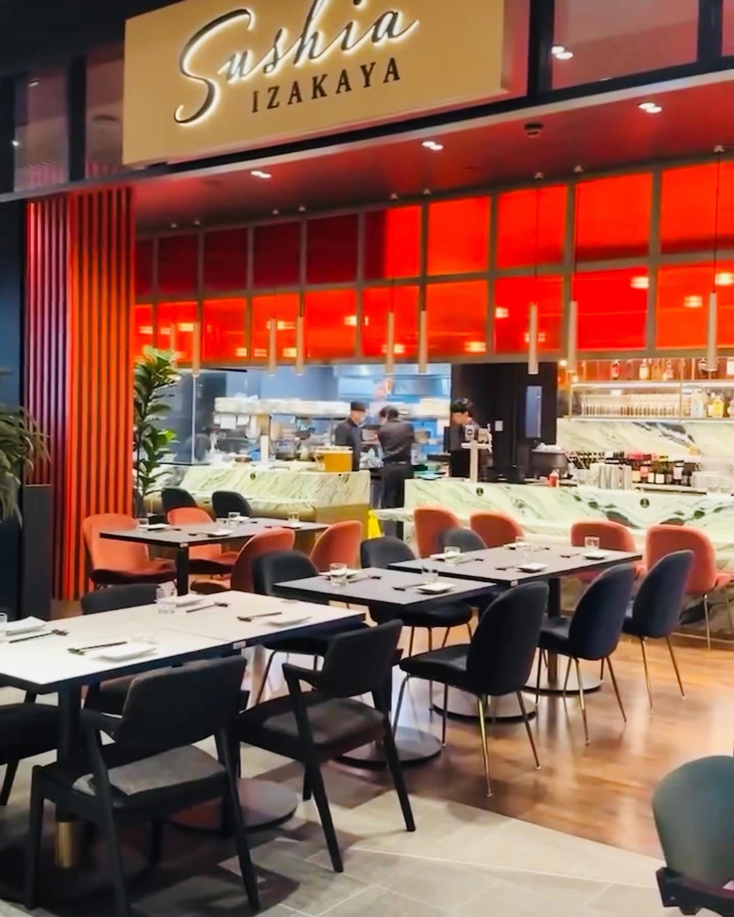 A Red Restaurant With Tables And Chairs — Nyon Shopfitters in Morisset, NSW