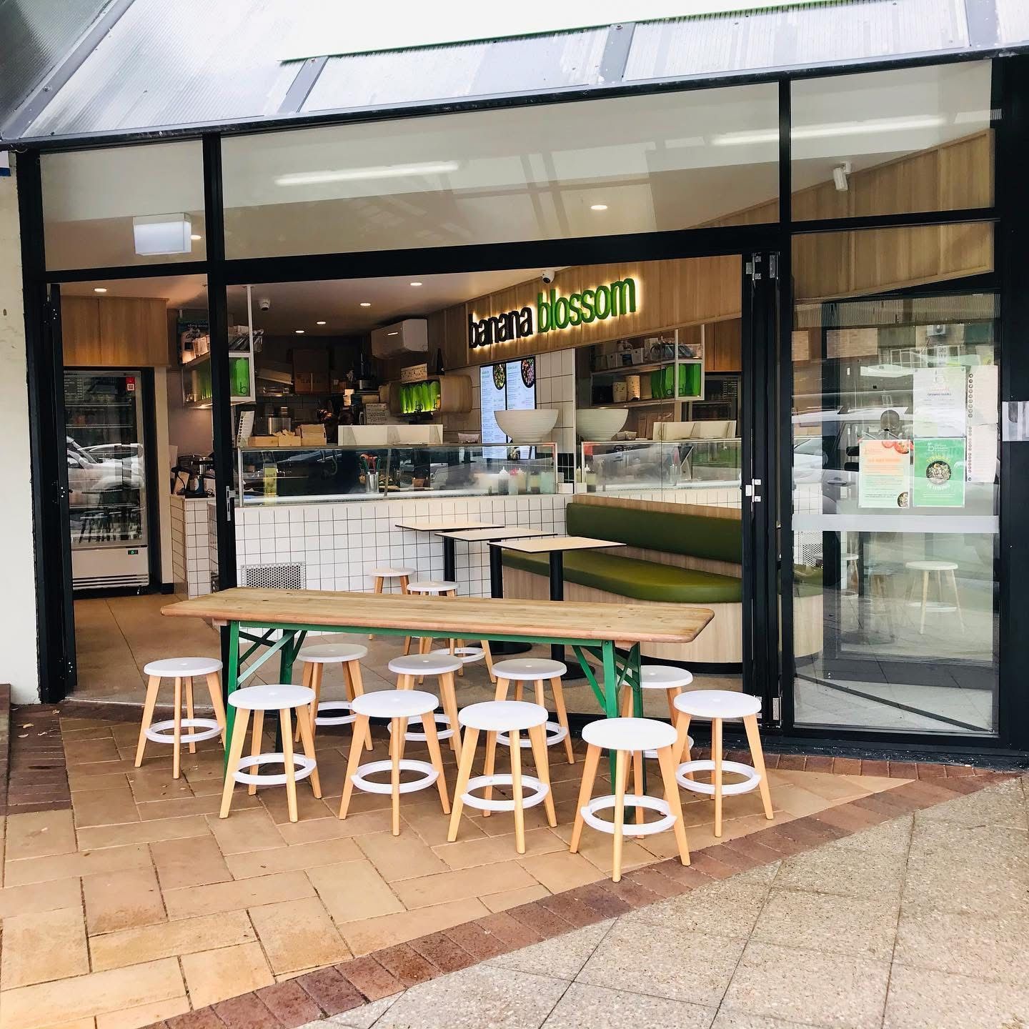 The Outside Of A Restaurant With Tables And Stools — Nyon Shopfitters in Morisset, NSW