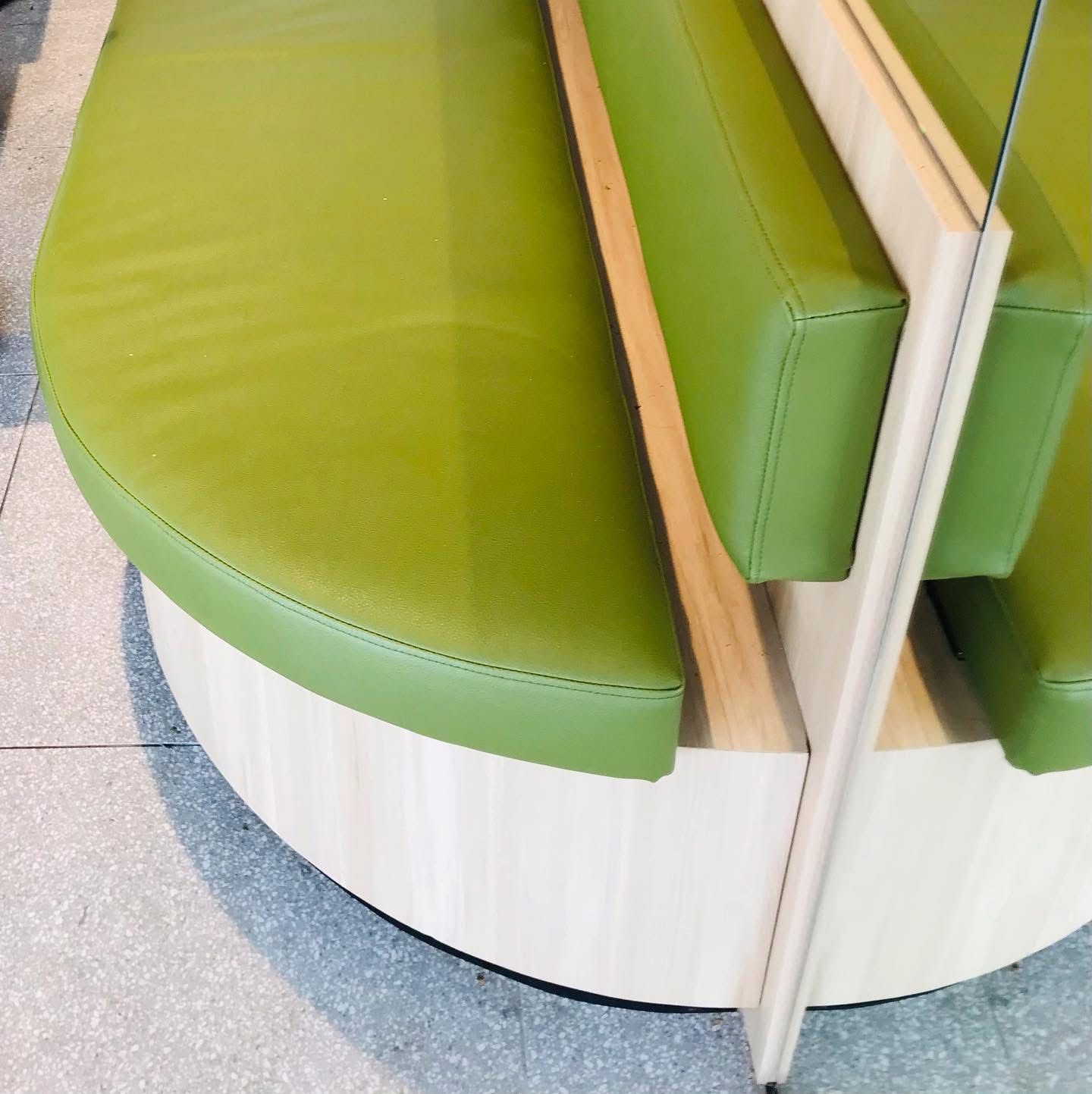 A Close-Up Of A Green Couch On A Tiled Floor — Nyon Shopfitters in Morisset, NSW
