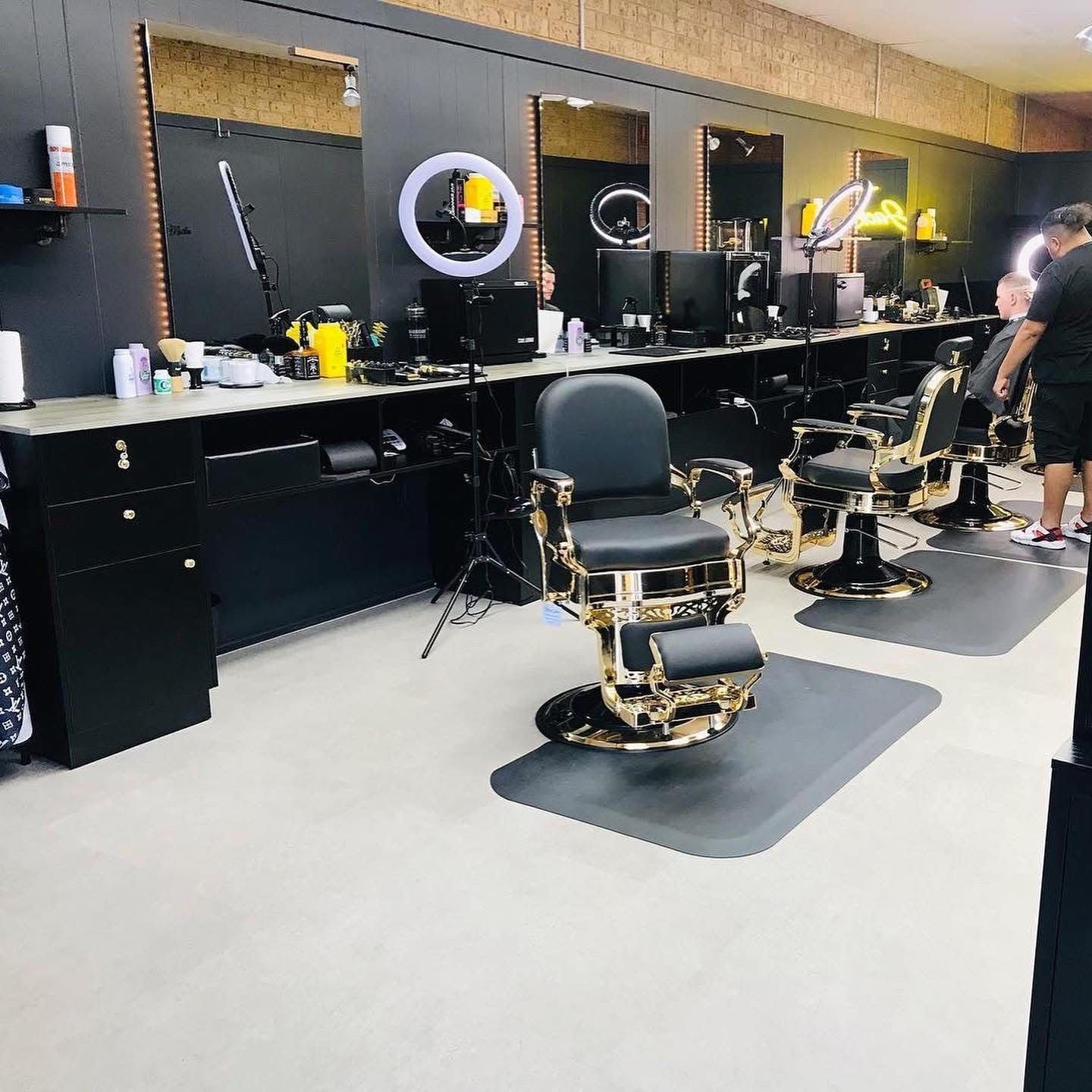 A Barber Shop With A lot of Chairs and Mirrors — Nyon Shopfitters in Morisset, NSW